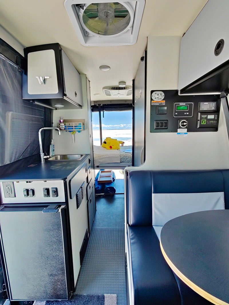  facing the wide-open salt flats for an adventure.|An RV rental offers a cozy bed view of the Bonneville Salt Flats — photo 9