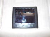 Furrion RV media control panel in an RV rental. This touchscreen system manages entertainment with USB/AUX inputs.