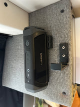 Furrion portable speaker & USB charging hub mounted in an RV rental. Ideal for music & device charging while traveling.