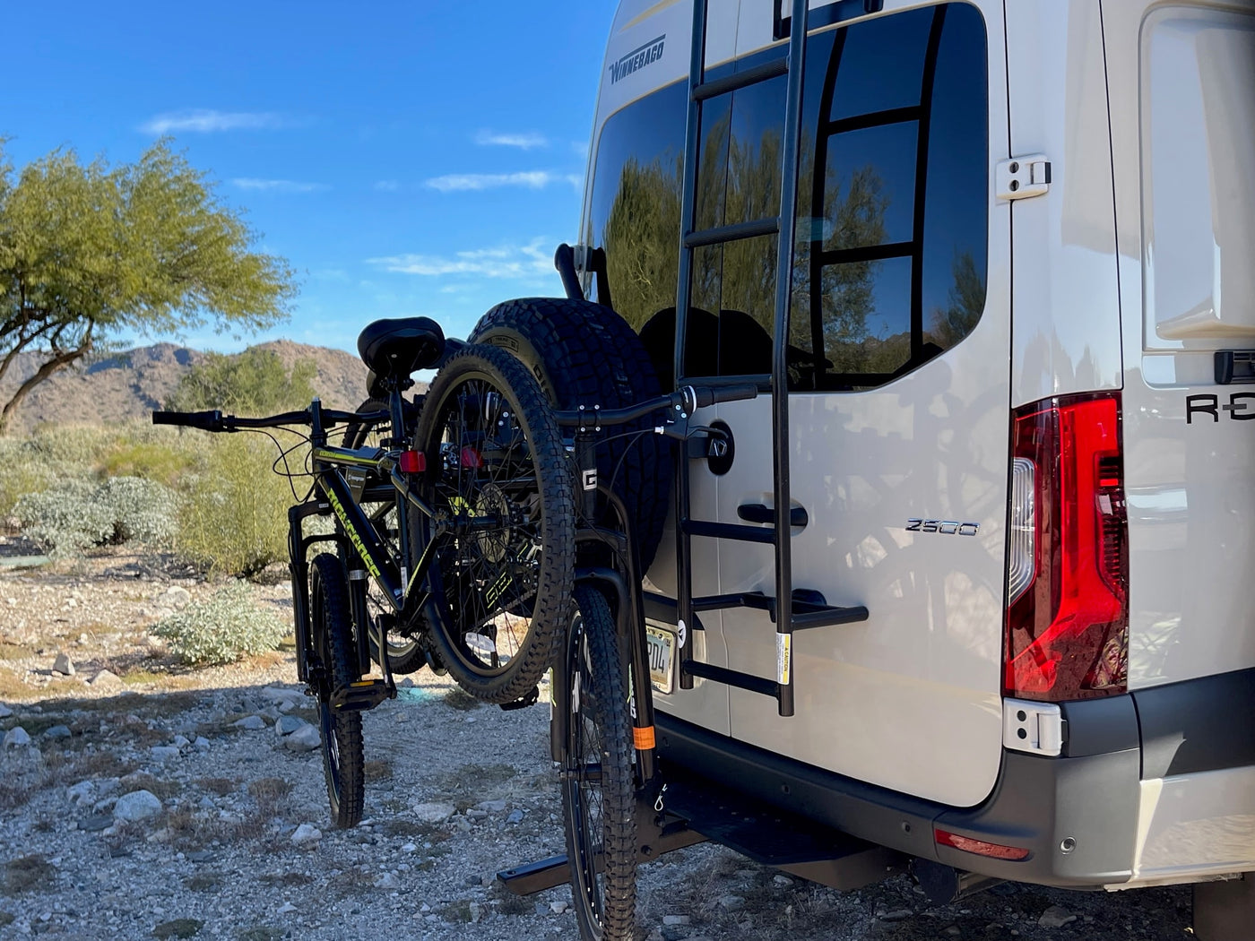  and pan. Perfect for adventurers on the go.|RV rental: Inside a camper van with blue/white bench seating — photo 15