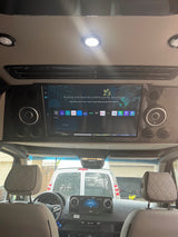 RV rental interior with a large overhead smart TV showing Samsung Smart Hub, perfect for entertainment on road trips.