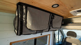 Maximizing space in this rv rental campervan with an overhead fabric storage bag, ideal for organizing your adventure essentials.