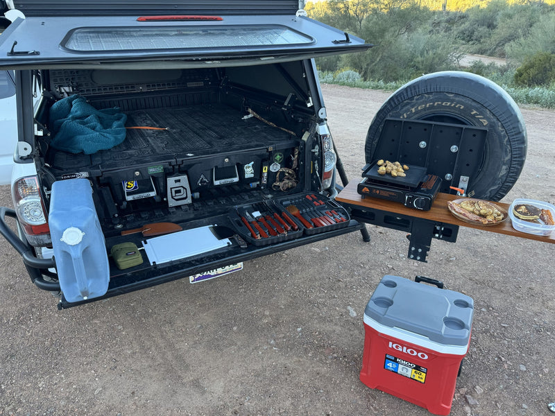 Adventure-ready truck with a camp kitchen, grill, and breakfast spread. Ideal for camping trips or your next rv rental exploration! — photo 2