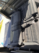  showing floor dimensions near a seat base. Perfect for planning.|Versatile vehicle interior with seats folded for cargo; perfect for an RV rental.|Spacious RV rental interior: dark fabric seats measured 7'1" long by a phone app