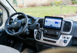 Spacious RV rental cabin with large infotainment screen, RAM steering wheel, and modern climate controls for comfortable travel.