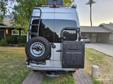 Silver Sprinter van, a custom rv rental, with rear ladder, spare tire, and gear storage for your next trip.
