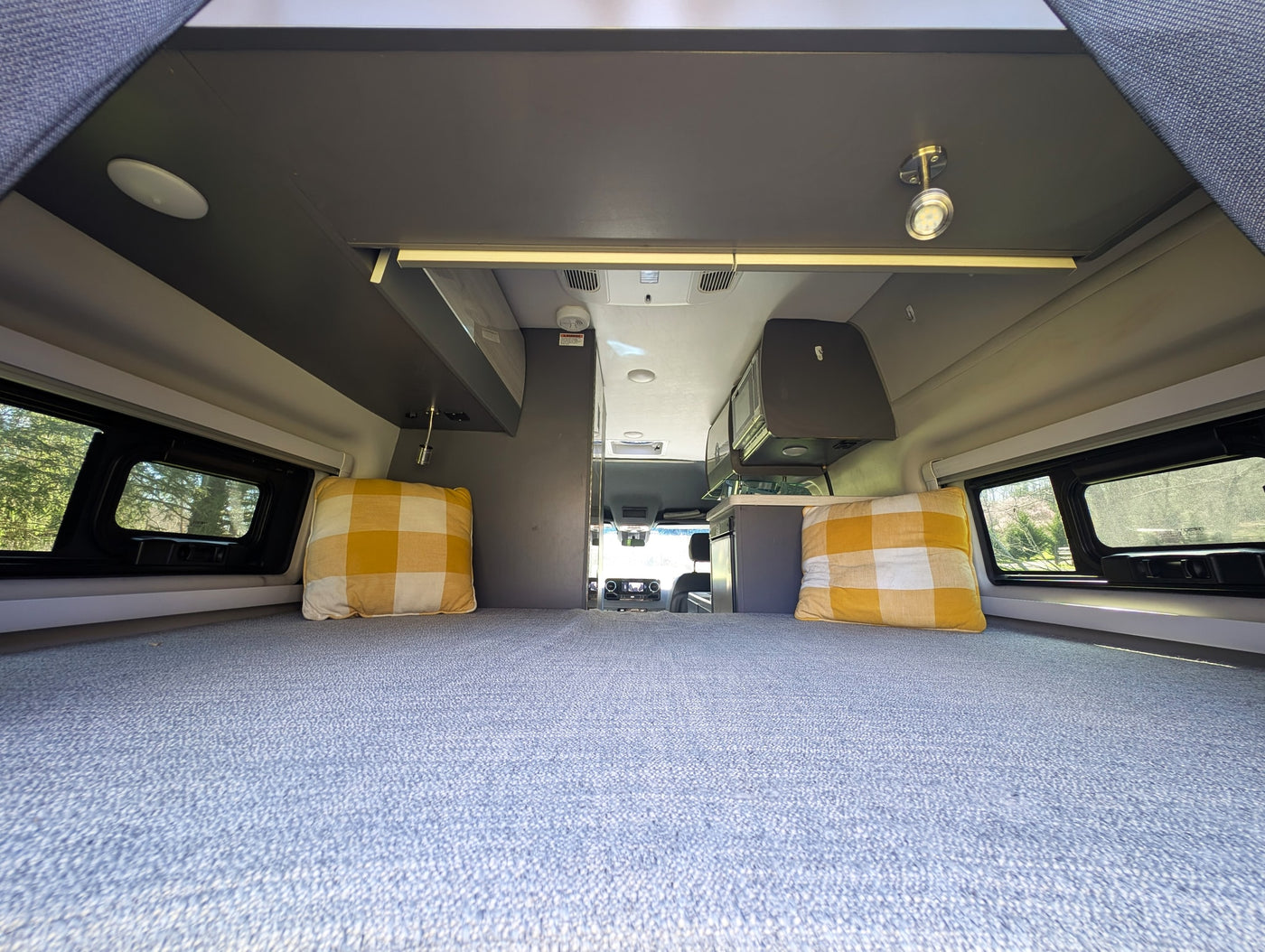  parked in a sunny grassy field.|Silver Sanctuary RV rental — photo 9