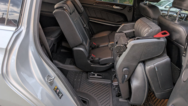 Car interior with versatile folding seats, perfect for family travel or cargo in an RV rental alternative. — photo 13