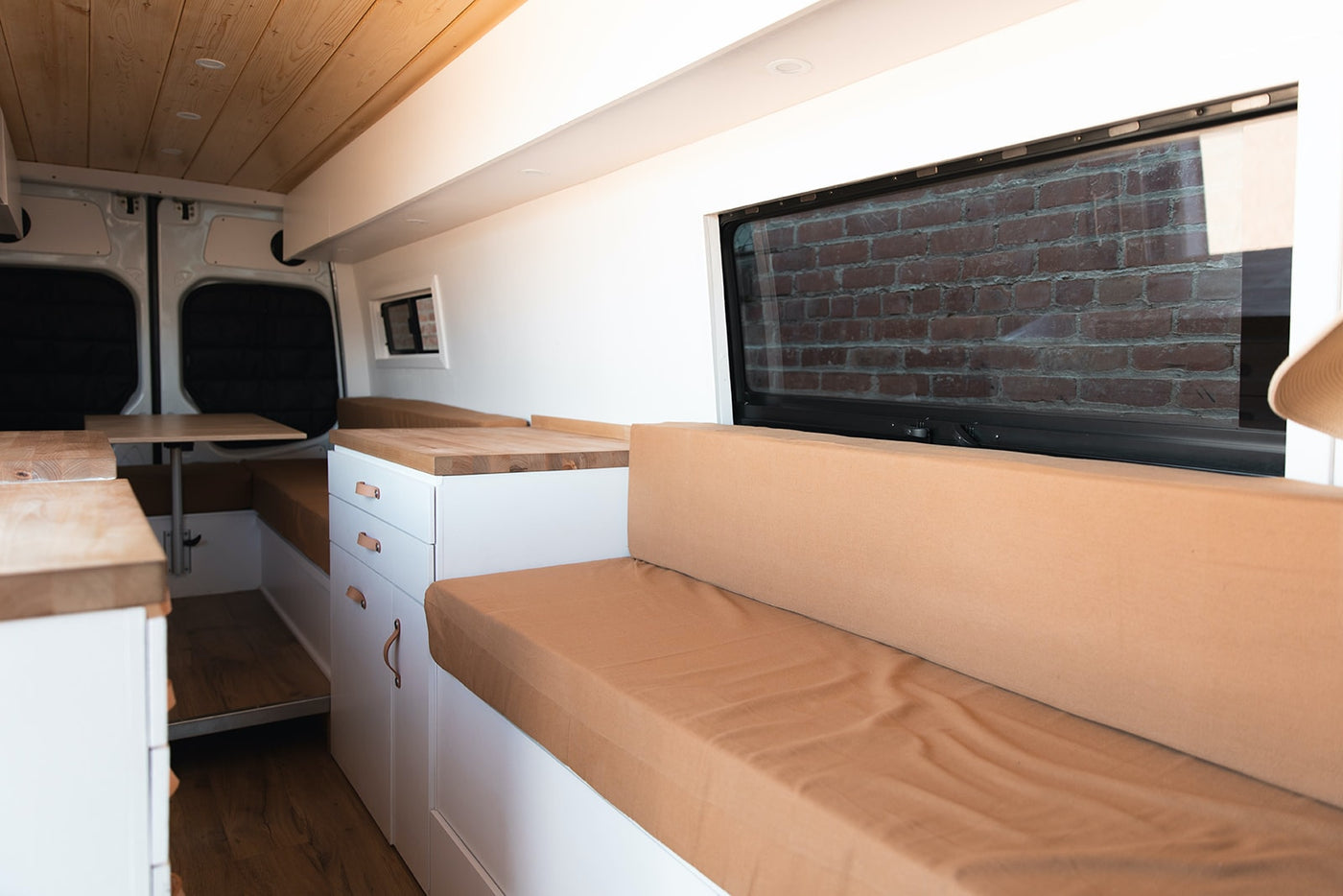  open door reveals custom interior by a tree.|RV rental: Clean — photo 3