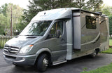 Gray Mercedes Sprinter RV (Leisure Unity) with an extended side panel. Ideal for rv rental adventures & travel.