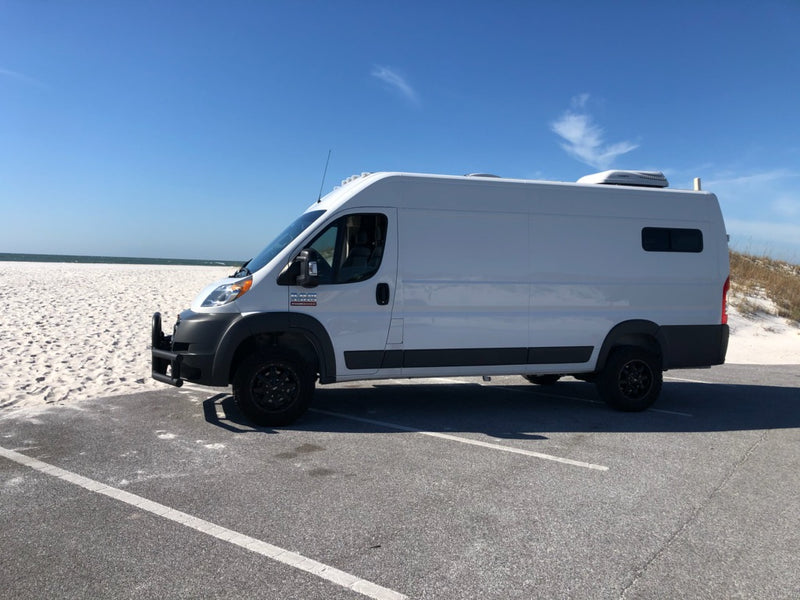 White Ram ProMaster camper van by a sunny white sand beach. Ideal for an RV rental beach adventure. — photo 8