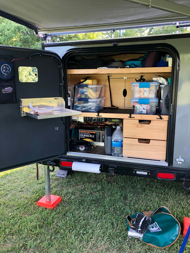  ideal for adventure.|RV rental's convenient outdoor galley with storage shelves — photo 2