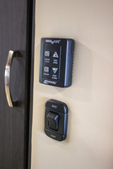 RV rental interior showing MaxxAir fan controls (on/off, vent open/close) and a "BATH LIGHT" switch on a textured wall.