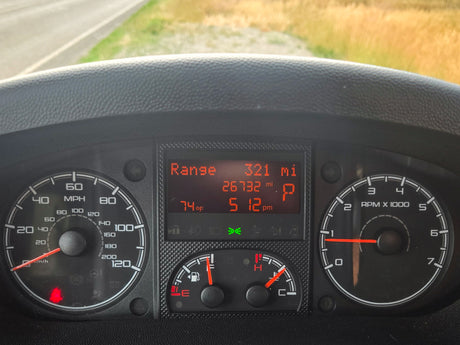 Inside an RV rental: Dashboard shows 0 mph, 74°F, 5:12 pm, full tank, 26,732 mi. In Park, ready for adventure.