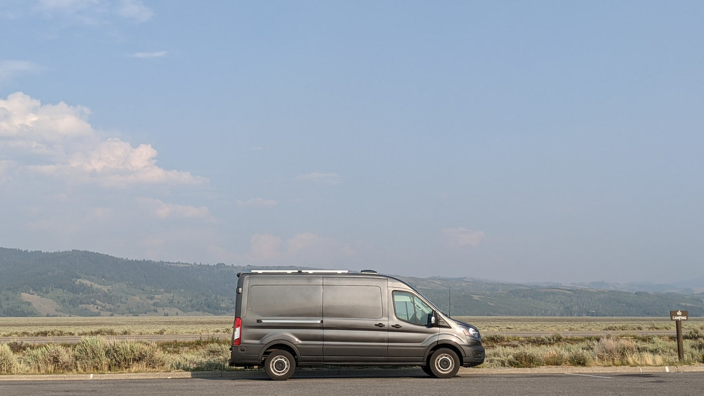  and view through the windshield of a street.|Woman relaxes in an **rv rental** camper van in a dry — photo 9