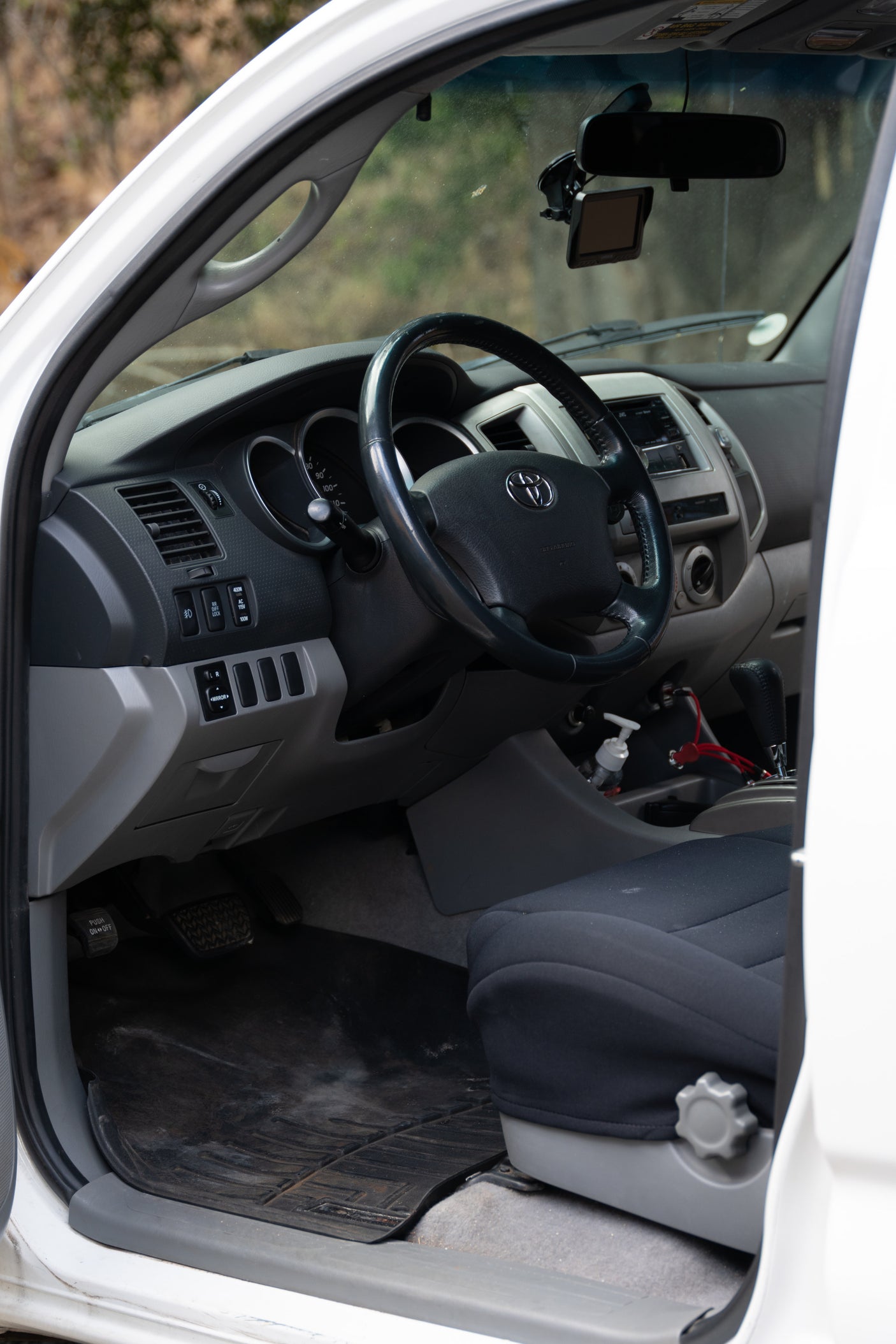 Inside this **rv rental** truck/SUV, the driver's area shows the dashboard, steering wheel, climate controls, and GPS.