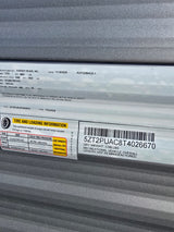 Essential RV rental info: VIN 5ZT2PUAC8T4026670, tire pressure (65 PSI), cargo & dry weight, and length 16'0".