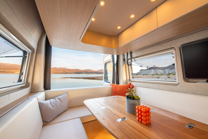 Cozy RV rental interior with panoramic lake and mountain views. Perfect for travel & adventure. — photo 9