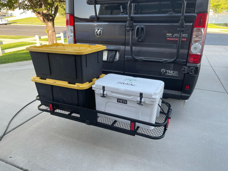 RV rental prep: Thor Ram van's rear with hitch cargo carrier, holding storage bins & a Yeti cooler for your trip. — photo 19