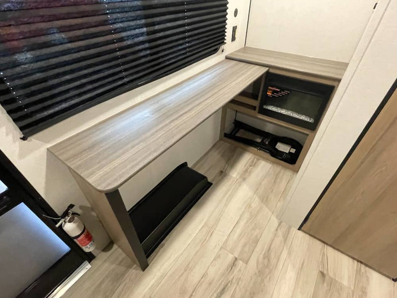  and exterior storage.|Bright RV rental interior features a compact kitchen with microwave — photo 7
