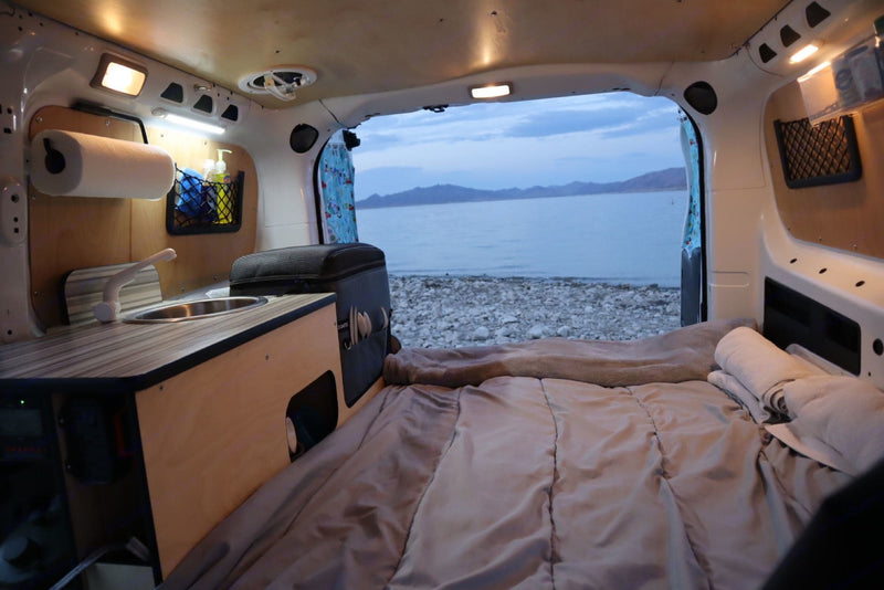  featuring a compact kitchen & cozy bed — photo 2