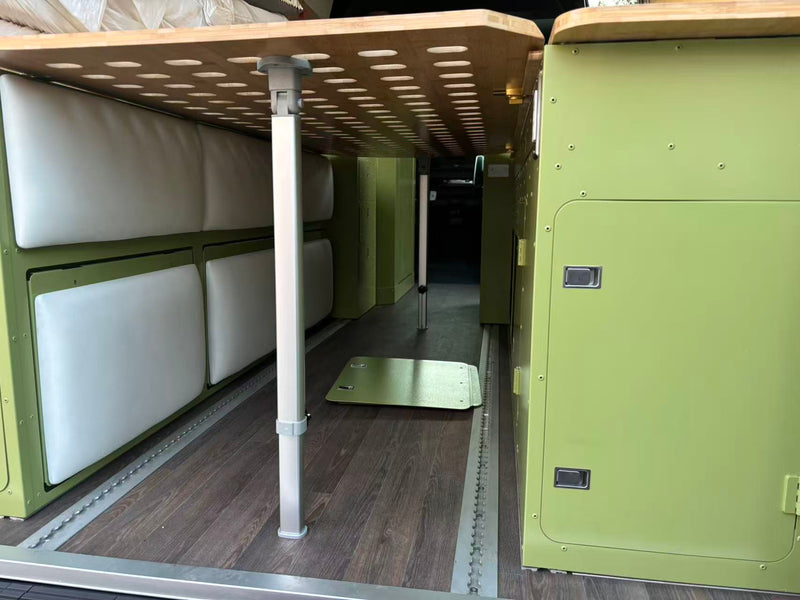  and stylish olive green and bamboo storage.|Spacious RV rental interior with custom green cabinetry — photo 19