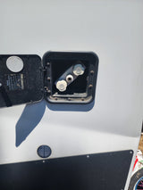 RV rental outdoor wash station with open access panel, showing hot/cold water valves & instructions. Not for drinking.