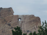 Crazy Horse Memorial: a massive mountain carving in progress, showing a face and the outline of a horse. Perfect for an RV rental trip!