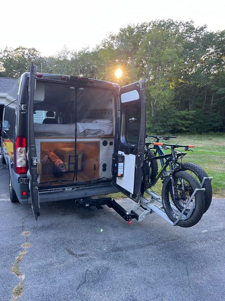  sitting on a wooden counter.|Two fat tire bikes