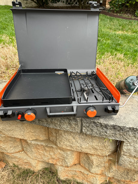 Portable Blackstone griddle/stove, ideal for RV rental excursions, offers outdoor cooking for camping trips.