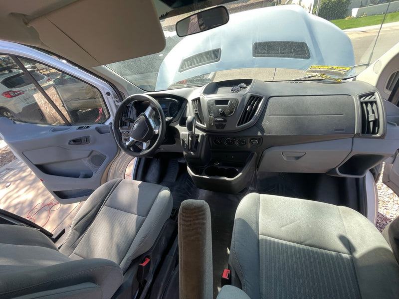 Inside a white Ford Transit van, hood open for service. Clean and spacious, ready for your next rv rental trip. — photo 18