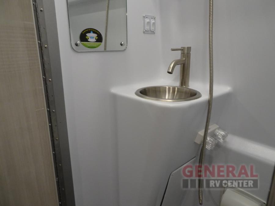  and front seats.|Bright RV rental shower stall with LED lights — photo 15