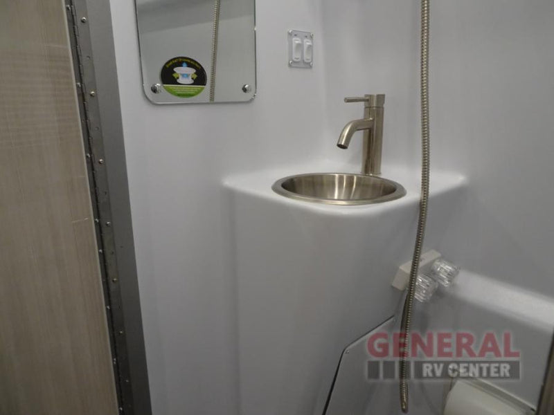  and front seats.|Bright RV rental shower stall with LED lights — photo 15