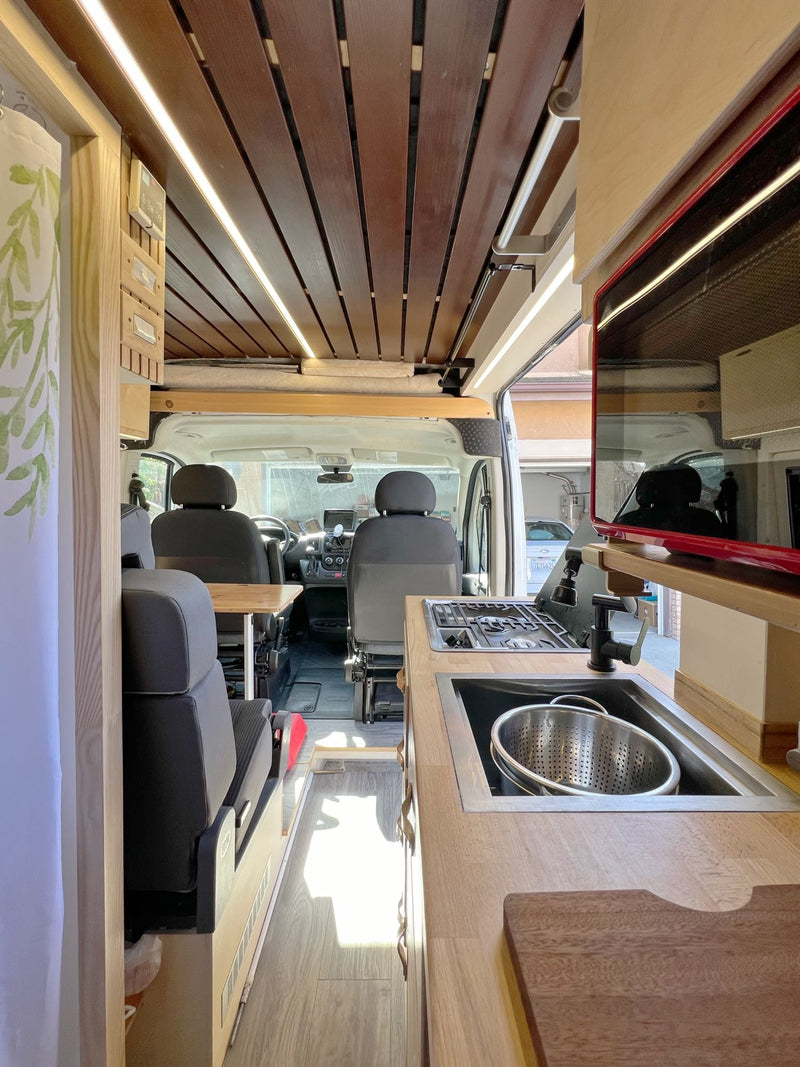  cozy interior and extended awning.|White Ram ProMaster rv rental — photo 7