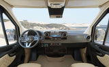 Modern Mercedes-Benz RV rental interior, showing its detailed cockpit with screen and steering wheel, overlooking a beach.