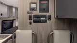 RV rental: Detailed view of the RV's control panel wall, featuring solar, water, heat, and LP gas systems.