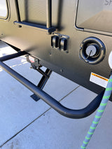 RV rental exterior shows a water fill port, extend/retract switches for leveling or awning, and part of an access ladder.
