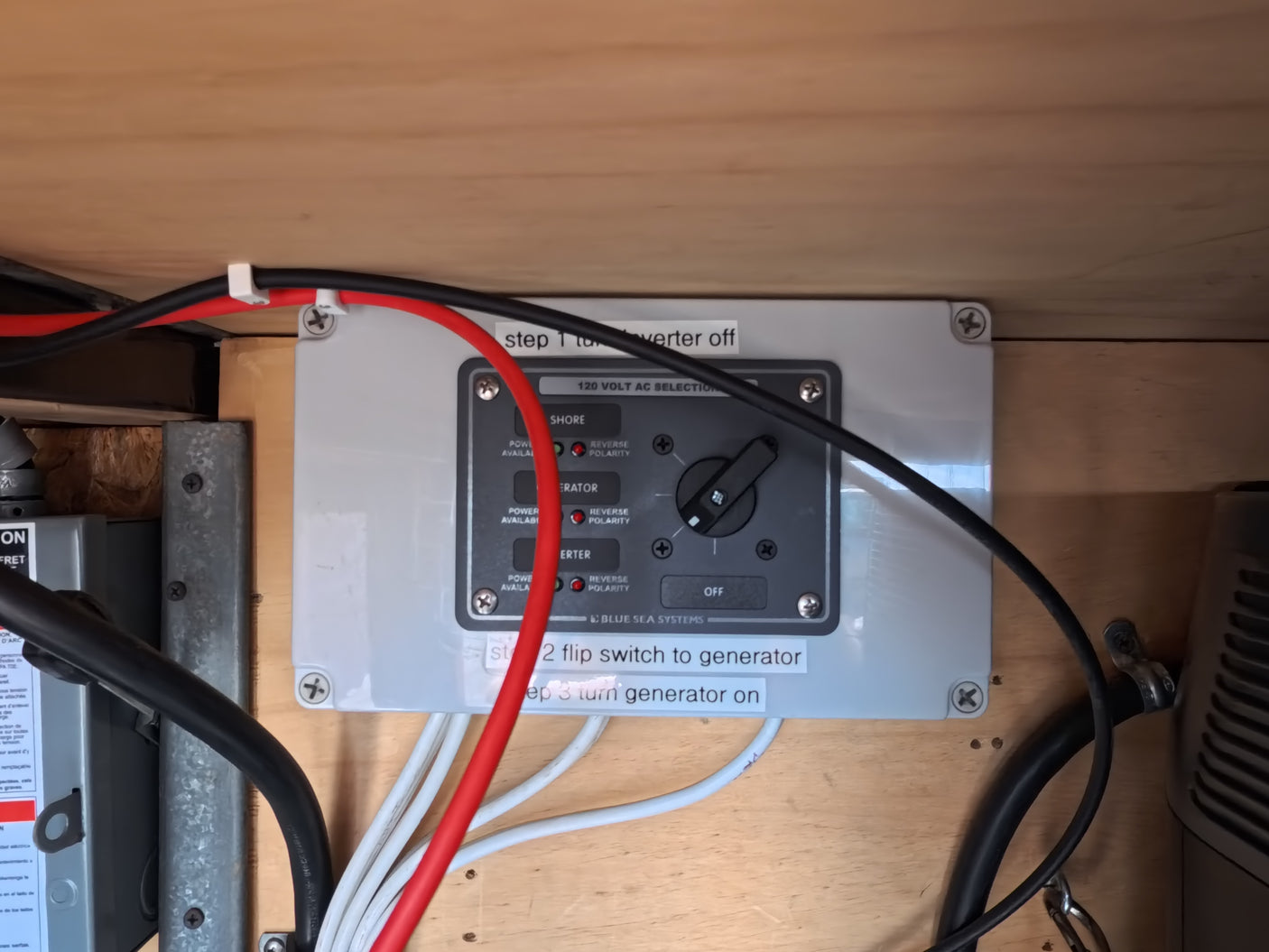 RV rental power selector switch (Blue Sea Systems) managing shore, generator, and inverter power, with operating steps.