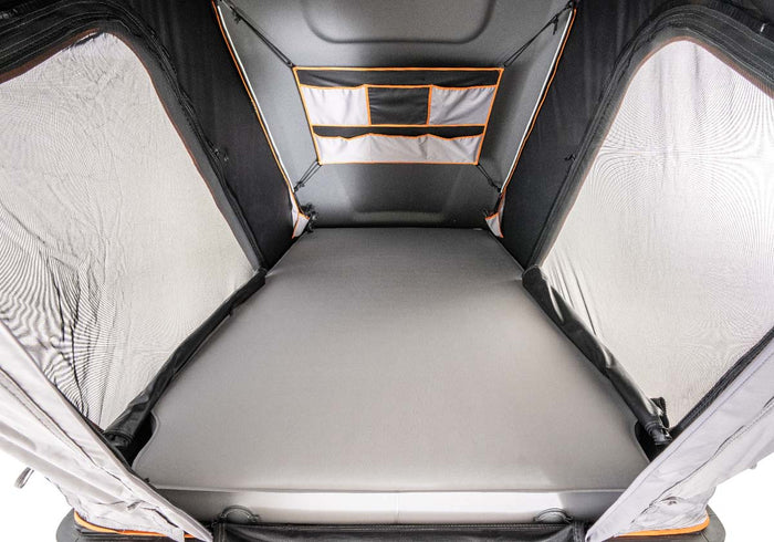  perfect for an adventurous RV rental.|Grey rooftop tent open on vehicle roof