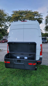 Rear view of an RV rental van with an open StowAway cargo box, offering ample external storage.