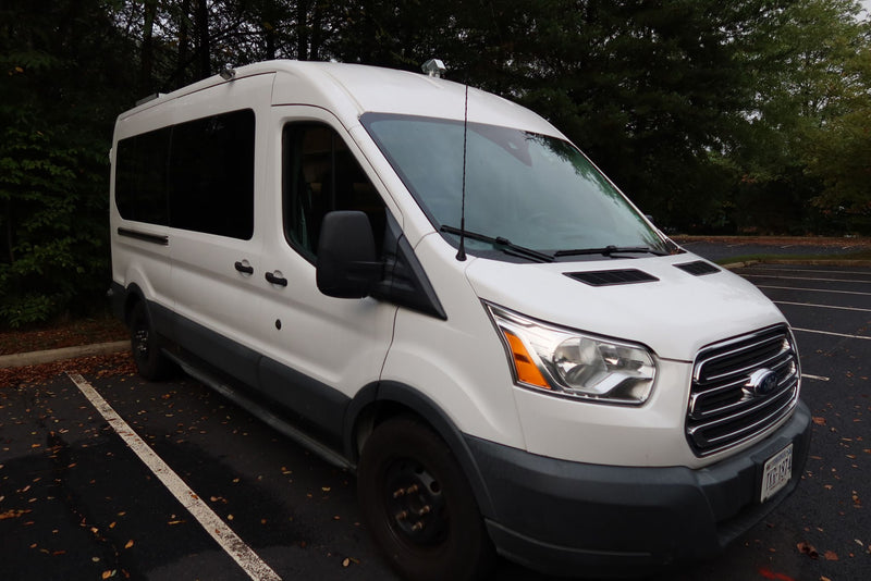 White Ford Transit van — photo 1