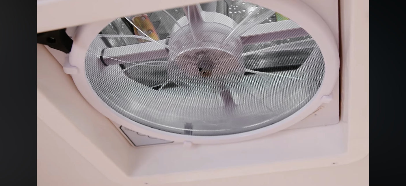 Get fresh air in your RV rental with this ceiling vent fan and screen, ensuring comfort and great airflow.