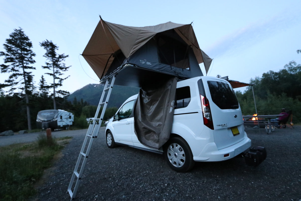 Camping adventure with an RV rental van featuring a rooftop tent and annex, set up at a scenic campground. — photo 7
