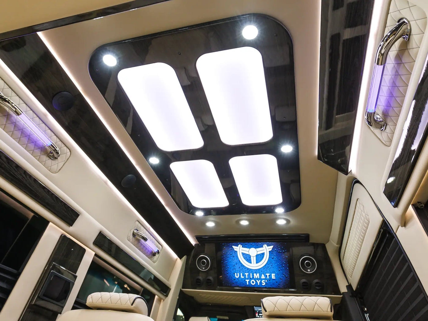  and elegant wood grain accents.|Luxury rv rental interior: an overhead Garmin display shows satellite navigation — photo 7