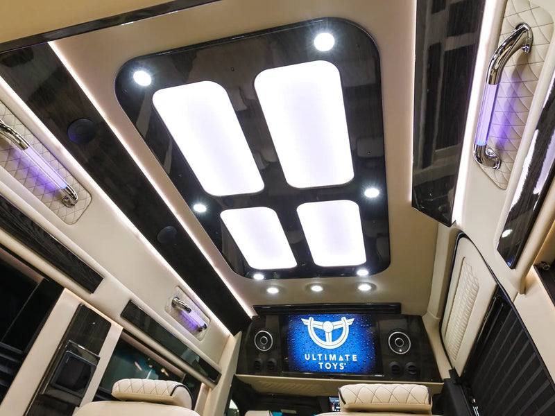  and elegant wood grain accents.|Luxury rv rental interior: an overhead Garmin display shows satellite navigation — photo 7