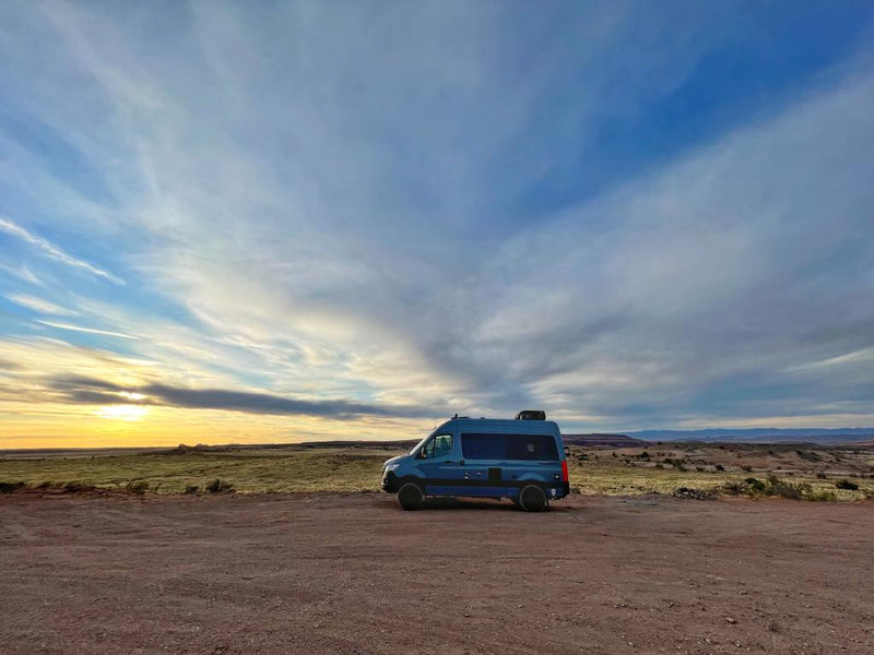  cloudy landscape.|Spacious rv rental interior featuring a modern kitchen with stovetop — photo 3