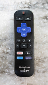 A Westinghouse Roku TV remote, with Netflix, Apple TV+, Paramount+, and HBO Max buttons. Essential for smart TV entertainment on your rv rental.