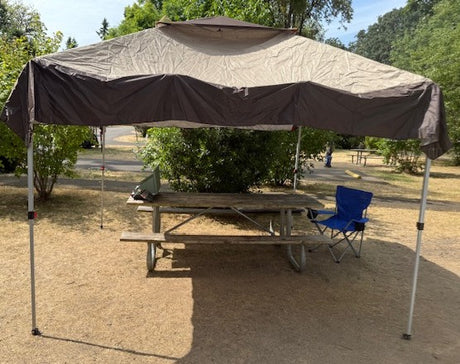 Enjoy outdoor dining at your campsite! A pop-up canopy provides shade and rain protection. Sides to the canopy are included