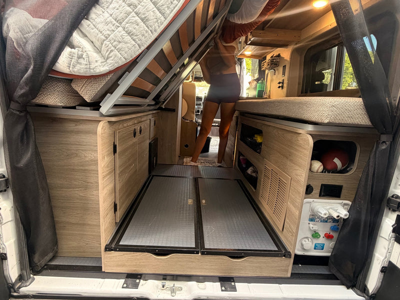  and adjacent bed area.|Spotless RV rental mini-fridge with open door — photo 16