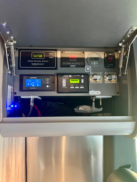 RV rental's control panel: Xantrex power, SeeLevel II tank levels, generator, and heating/WiFi switches.